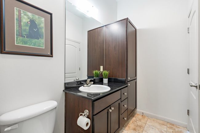 Bathroom featuring vanity, toilet, and baseboards | Image 15