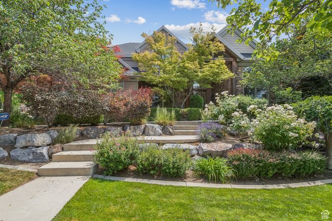 Obstructed view of property with a front lawn | Image 64