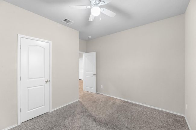 View of 1st floor bedroom conveniently next to a full bathroom. | Image 10