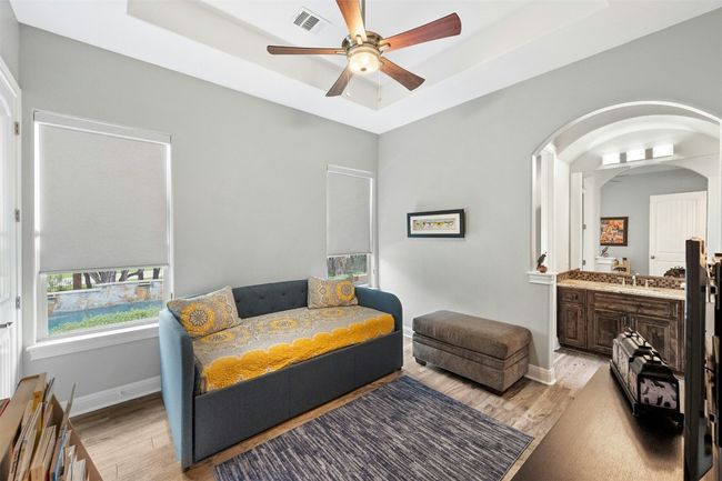 Secondary bedroom has jack and jill bathroom and overlooks backyard. | Image 28