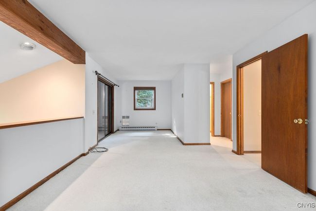 Spacious primary bedroom features a sitting area! | Image 30