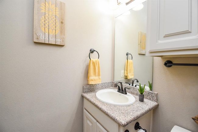The bathroom in the casita has granite counters and cabinet storage. | Image 34