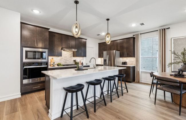 Spacious kitchen with ample cabinet space *Photos of furnished model. Not actual home. Representative of floor plan. Some options and features may vary | Image 6