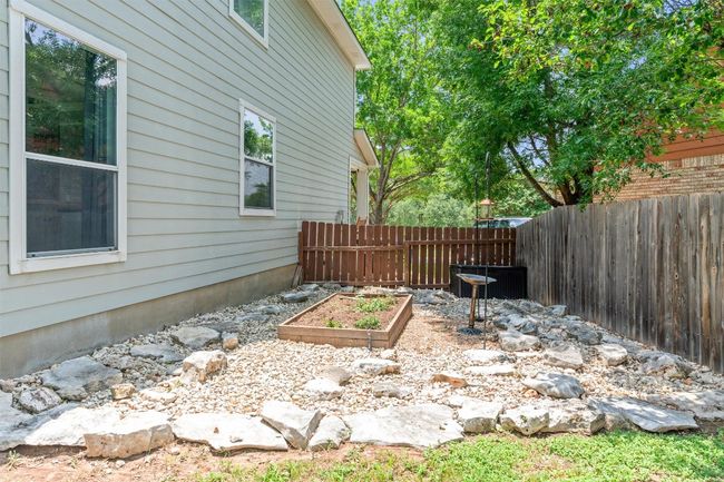 View of yard featuring a garden | Image 37