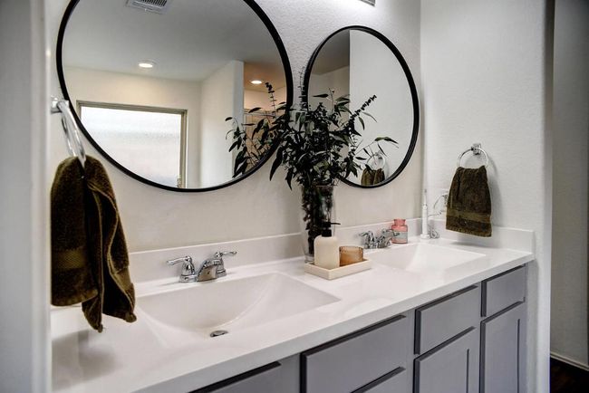 Full bath featuring a sink, visible vents, and double vanity | Image 20