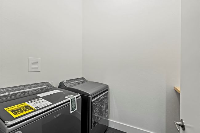 Laundry area featuring baseboards, laundry area, and independent washer and dryer | Image 30