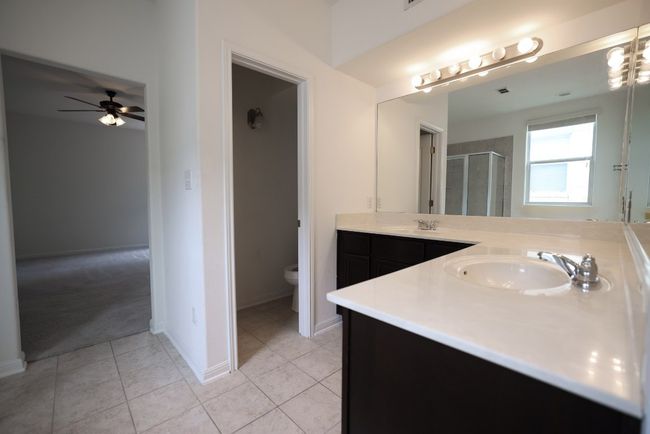 Enjoy your own private ensuite bathroom with a spacious wrap around dual vanity plus a private toilet and a walk-in closet. | Image 12
