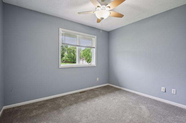 In addition, this room has a ceiling fan and white woodwork | Image 20