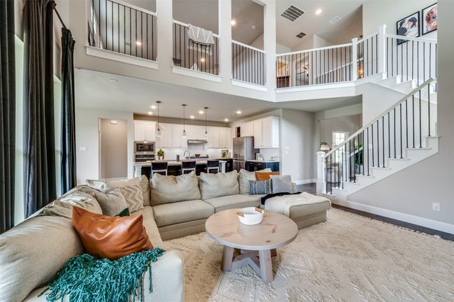 Living area with stairs, visible vents, and baseboards | Image 7