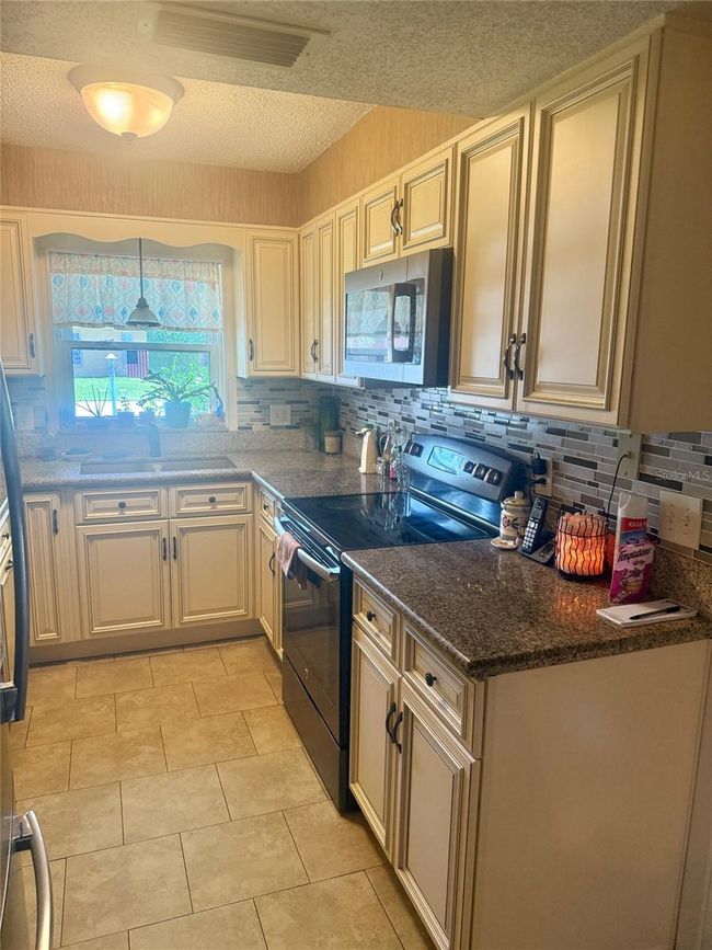 1814 Driftwood Cir S, House other with 4 bedrooms, 2 bathrooms and null parking in OLDSMAR FL | Image 11
