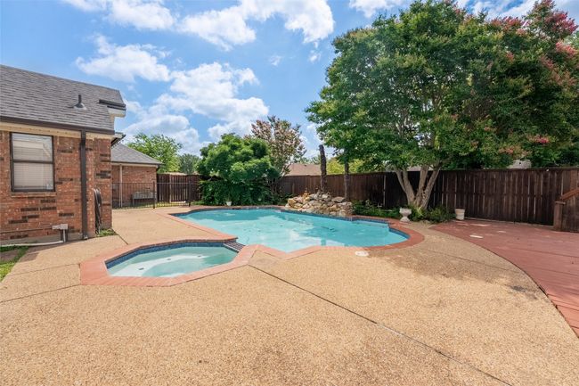 View of pool featuring an in-ground hot tub, a fenced backyard, and a patio | Image 27