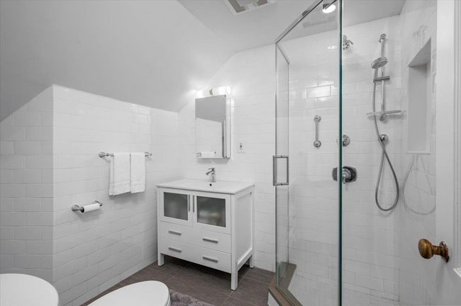 Bathroom featuring a stall shower, visible vents, toilet, and tile patterned flooring | Image 18