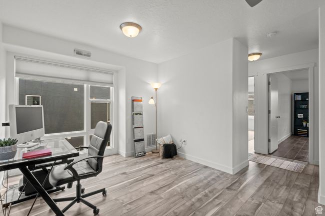 Home office featuring wood finished floors and baseboards | Image 31