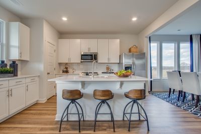 Kitchen equipped with stainless steel appliances including fridge *Photos of model home, same floor plan. Features/finishes vary. See onsite agent for details | Image 3