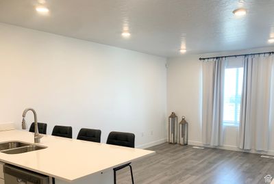 Office area featuring sink and light wood-type flooring | Image 3