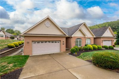 A level walkway off the drive leads to the entry | Image 3