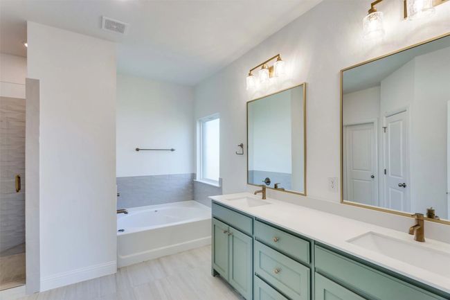 Bathroom featuring vanity and plus walk in shower | Image 12