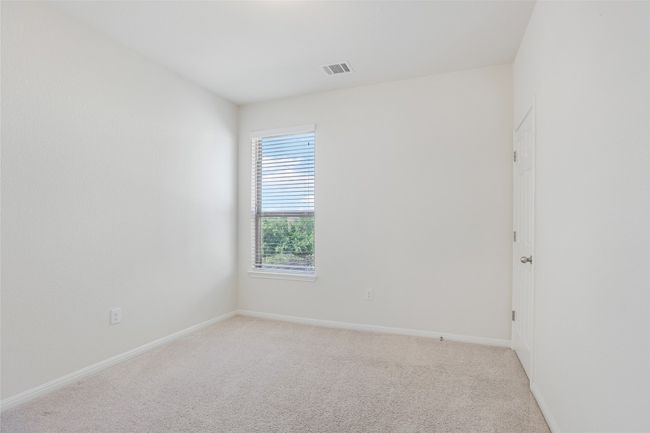 Unfurnished room featuring light colored carpet, baseboards, and visible vents | Image 18