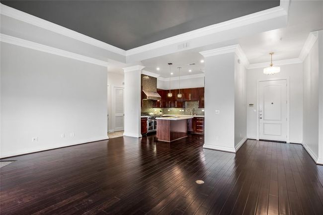 To the left is the primary bedroom and another secondary bedroom with an en-suite bathroom. | Image 15