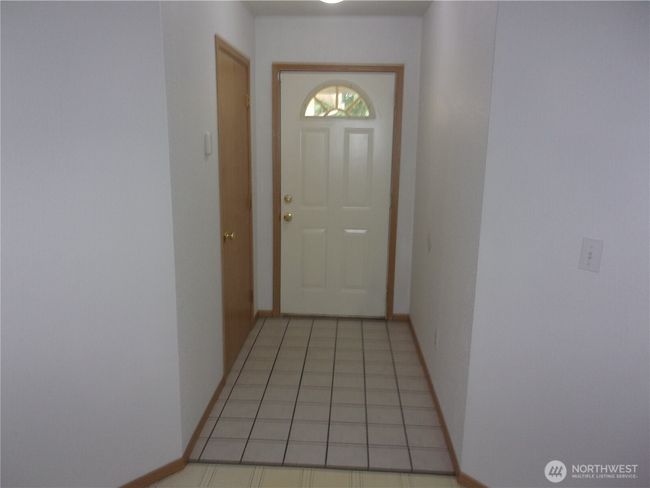 Tiled entry hall from the front door. | Image 8
