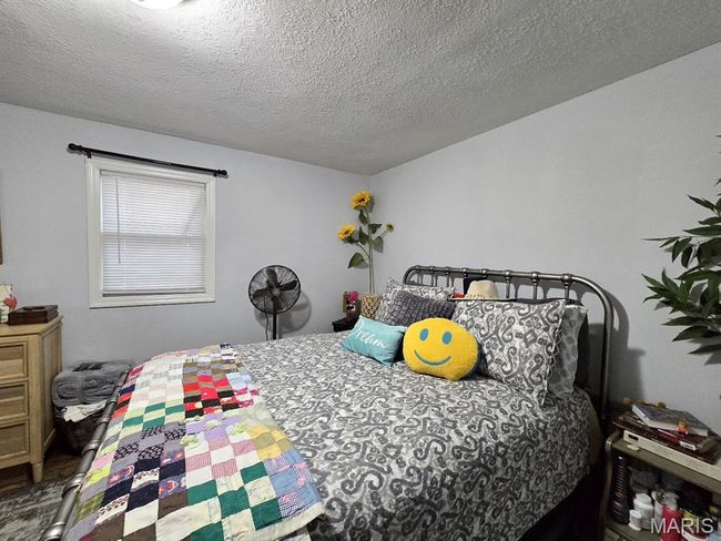 Bedroom featuring a textured ceiling | Image 14