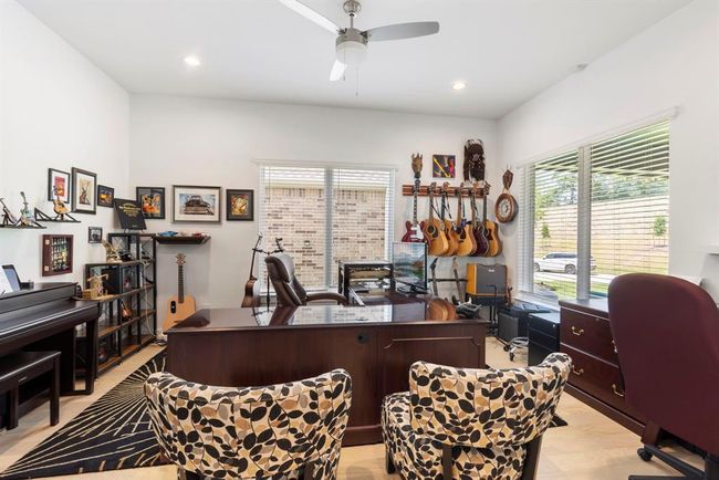 Expansive office featuring elegant double French doors. | Image 14
