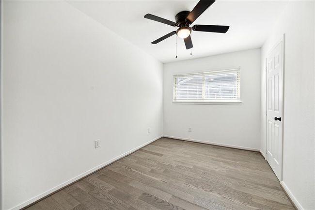 The smaller secondary bedroom is ideal for a home office or nursery. | Image 17