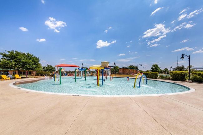View of pool with a water play area | Image 33