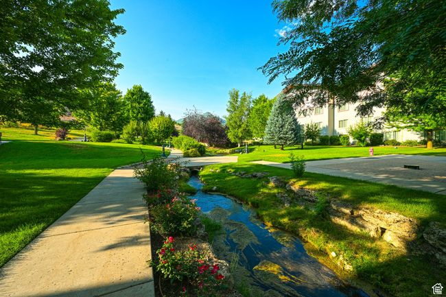View of home's community with a yard | Image 36