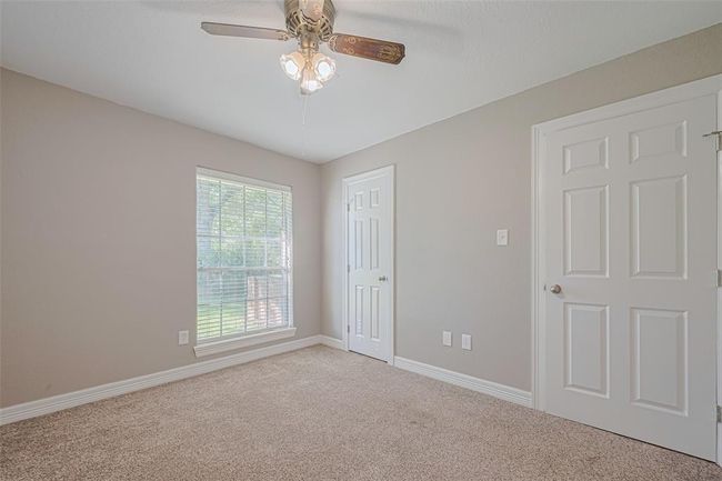 3rd bedroom offers lots of natural lighting from the large window, fan, and ample sized closet | Image 20