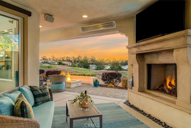 Outdoor fireplace, television outlet, infrared overhead heat, drop-down sunshade. | Image 47