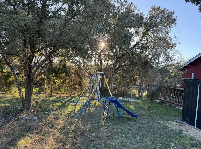 View of backyard with a yard. | Image 24