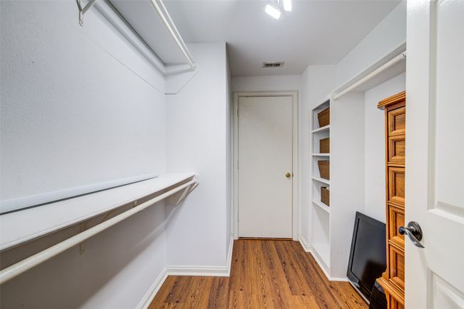Spacious closet featuring wood finished floors | Image 18