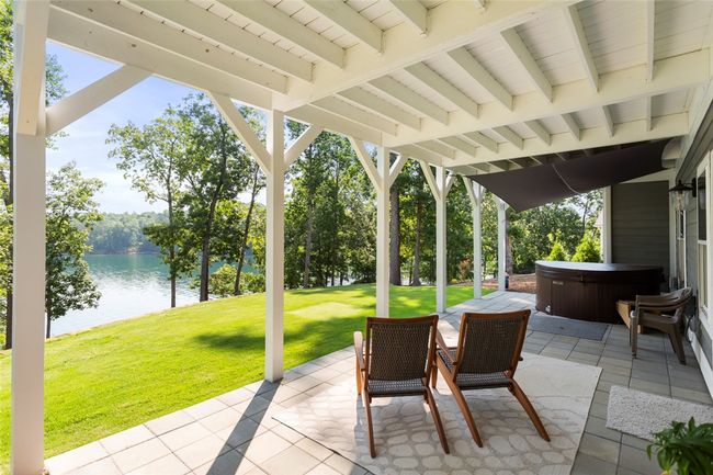 Large covered patio with hot tub | Image 35