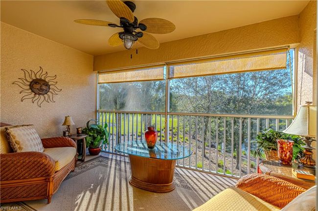 Sunroom / solarium featuring plenty of natural light and ceiling fan for those gorgeous Sunsets | Image 9