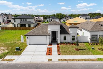 View of front of home featuring a front yard and a garage | Image 2