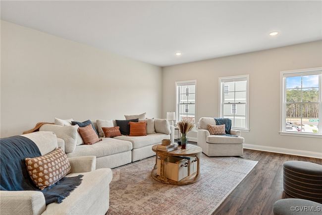 Living room with dark wood-type flooring | Image 12
