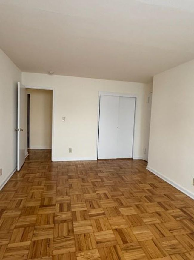 Unfurnished bedroom featuring a closet and baseboards | Image 10