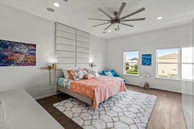 Experience serene mornings in this north-facing primary bedroom with tranquil water views, featuring an en suite bathroom and chic modern finishes. | Image 3