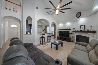 Welcome home! Relax in the Living room open to kitchen with bar stool overhang. | Image 1