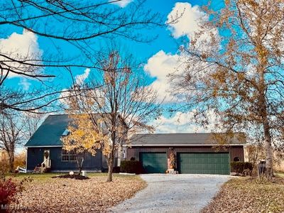 View of front of home with a garage | Image 1