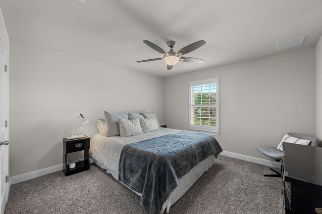 Bedroom featuring carpet and a ceiling fan | Image 31