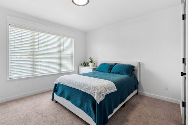 The fourth bedroom rests at the front of the home, perfect for guests. | Image 28