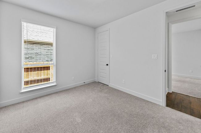 Unfurnished bedroom featuring carpet flooring and baseboards | Image 19