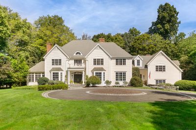 Set on two pristine acres offering extraordinary curb appeal from the moment you arrive | Image 2