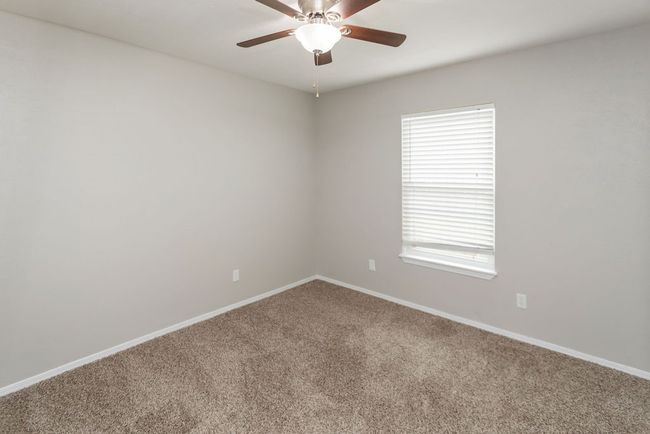 Bathroom featuring wood finished floors, vanity, and shower / washtub combination | Image 22