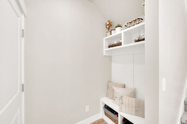 Mudroom with baseboards and lofted ceiling | Image 17