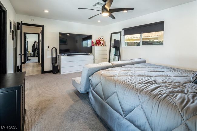 Bedroom with ceiling fan, recessed lighting, visible vents, and light carpet | Image 20
