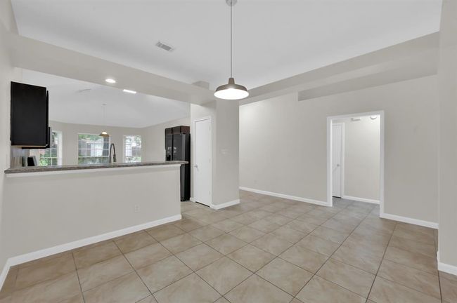 Dining area, by the breakfast bar. | Image 14
