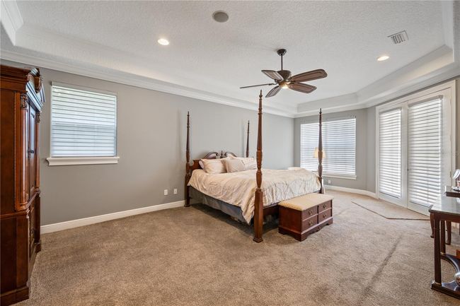 Primary suite, with motorized blinds and direct access to the lanai | Image 23